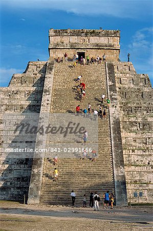 Tourists climbing El Castillo, pyramid dedicated to the god Kukulcan, Chichen Itza, UNESCO World Heritage Site, Yucatan, Mexico, North America