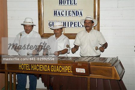 Musicians playing a type of xylophone, Hacienda Guachipelin, near Rincon de la Vieja National Park, Guanacaste, Costa Rica, Central America