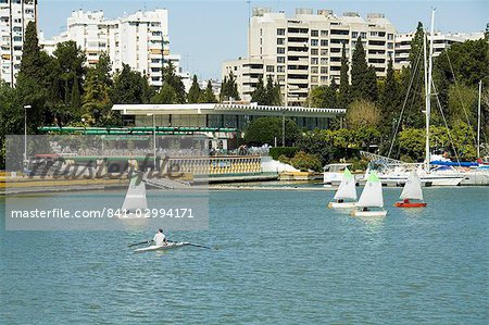 Sailing boats and sailing club in the background on the river Rio Guadalquivir, Seville, Andalusia, Spain, Europe