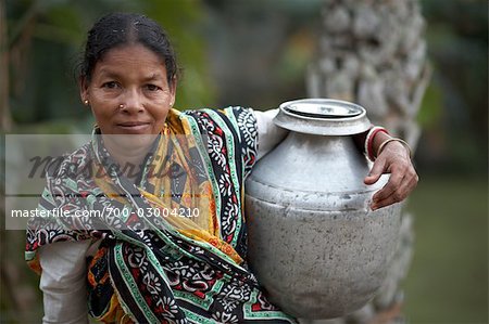 Woman Carrying Container, Namkhana Village, South 24 Parganas District, West Bengal, India