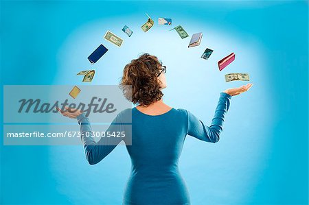 Woman juggling financial items