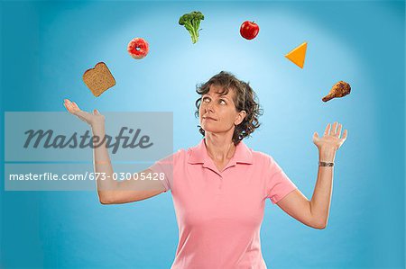 Woman juggling different foods