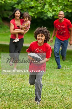 Family running in park