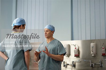 Medical staff in scrubs in discussion
