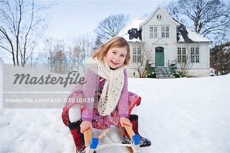 Scandinavian girl on a sled