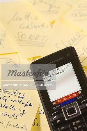Close-up of Text Message and Sticky Notes