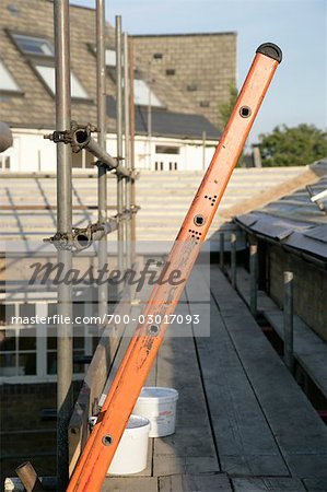 Scaffolding and Ladder Against Roof