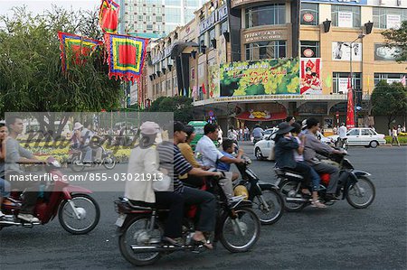 People on motorbike on Le Loi St.,Ho Chi Minh city,Vietnam