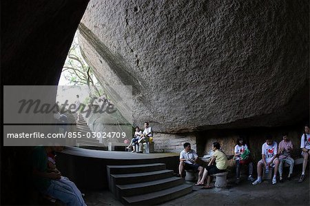 Tourists rest at the cave in Sunlight Park,Gulangyu Island,Xiamen (Amoy),Fujian Province,China