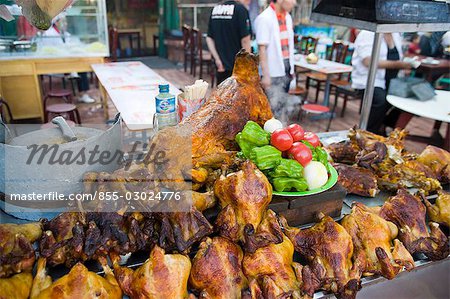 Roast chicken and lamb displaying in a food stall in the night market of Erdaoqiao,Wulumuqi,Xinjiang Uyghur autonomy district,Silk Road,China