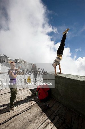 Tourists on Stroll pathway at Glacier of Yulongxueshan (Jade dragon snow mountain),Lijiang,China