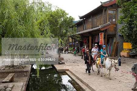 Horseback riding for tourist at Shuhe village,Lijiang,Yunnan Province,China