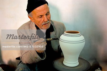 Man painting pottery vase, potters village of Safi, Atlantic coast, Morocco, North Africa, Africa