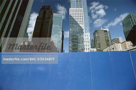 Skyscrapers behind a blue board,Manhattan,New York City,New York,United States of America,North America