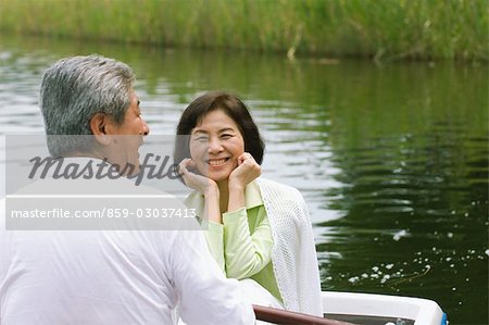 Older Couple In A Boat on a Lake