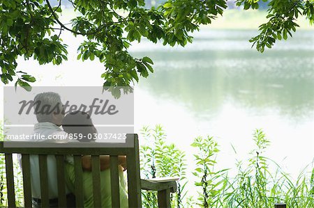 Couple Sitting Down on Bench