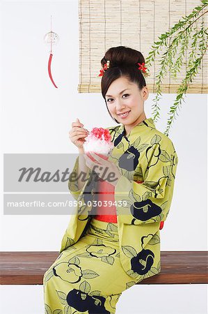 Woman in Kimono Eating Dessert