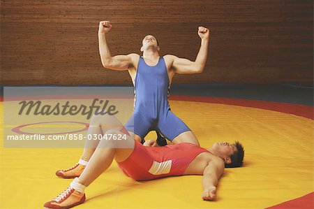 Wrestler Defeated with Winning Opponent Cheering