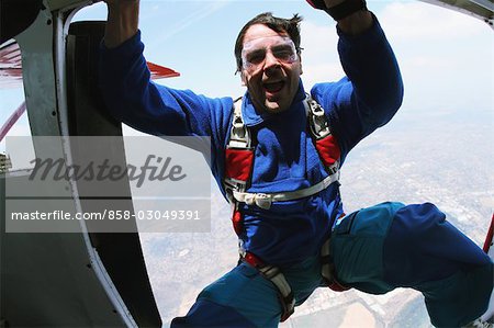 Man ready to jump from plane