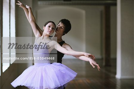 Ballet dancers practicing together in a room