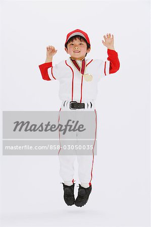 Smiling Japanese boy with medal