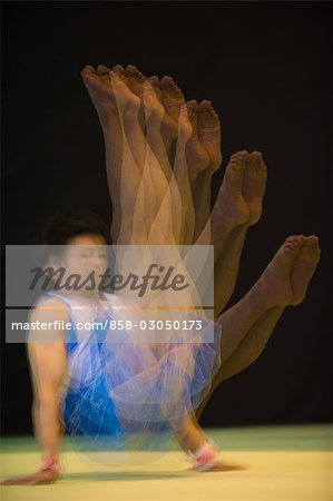 A young man performing gymnastics