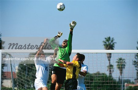 Soccer Players Heading the Ball