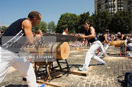 Log cutting strong man competition, during San Fermin, Running of the Bulls Festival, Pamplona, Navarra, Euskadi, Spain, Europe