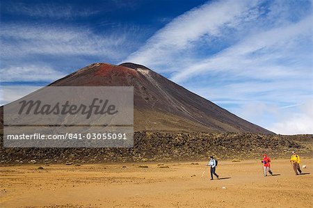 Hikers in front of Mount Ngauruhoe, 2287m, on the Tongariro Crossing, in the oldest national park in New Zealand, Tongariro National Park, UNESCO World Heritage Site, Taupo, North Island, New Zealand, Pacific