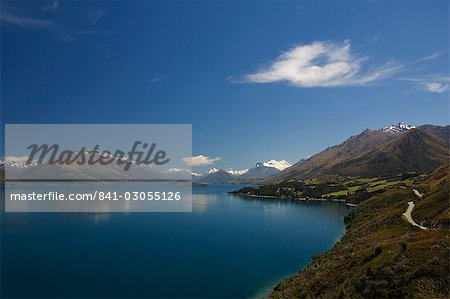 A winding mountain road on the edge of Lake Wakatipu near Queenstown, Otago, South Island, New Zealand, Pacific