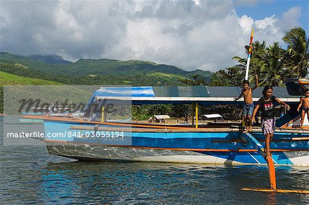 Chilldren playing on boat, Camarines Sur, Caramoan National Park, Bicol Province, southeast Luzon, Philippines, Southeast Asia, Asia