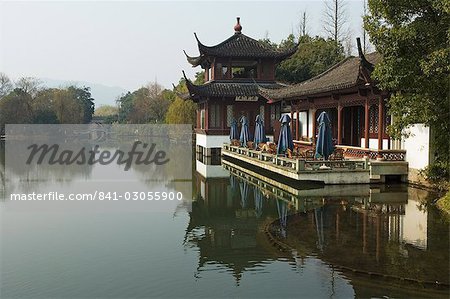 A waterside pavilion at Winding Garden at West Lake, Hangzhou, Zhejiang Province, China, Asia