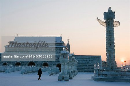 Sunset and replica Forbidden City ice sculpture at the Ice Lantern Festival, Harbin, Heilongjiang Province, Northeast China, China, Asia