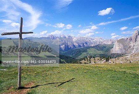 Christian crosses dominate most prominent peaks in Alps, view of Val Gardena from Sella Pass, 2244m, Dolomites, Alto Adige, Italy, Europe