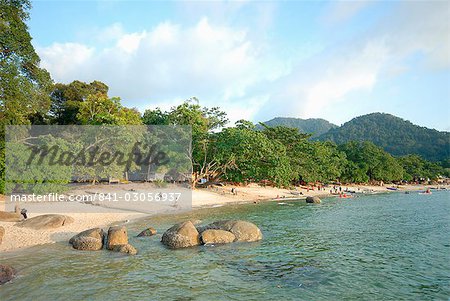 Tourists enjoying Nipah Beach at sunset time, Pangkor Island, Perak State, Malaysia, Southeast Asia, Asia