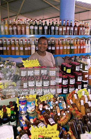 Woman selling locally produced food at the market in Sainte Anne, Martinique, Lesser Antilles, West Indies, Caribbean, Central America