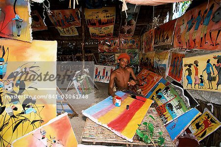 Local artist with his Tingatinga paintings, Zanzibar, Tanzania, East Africa, Africa