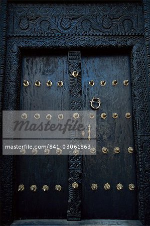 Traditional carved wooden door in Stone Town, Zanzibar, Tanzania, East Africa, Africa Traditional carved wooden door in Stone Town, Zanzibar, Tanzania, East Africa, Africa