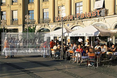 People sitting outside a cafe on Karlsplatz, Munich, Bavaria, Germany, Europe