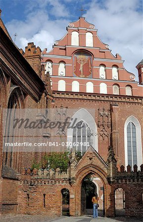 Bernardine church and monastery with a woman standing in the gateway, Vilnius, UNESCO World Heritage Site, Lithuania, Baltic States, Europe