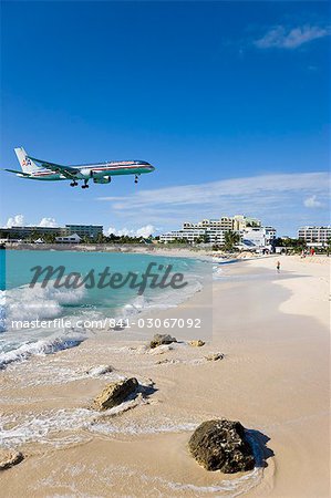 Beach at Maho Bay and low flying aircraft approaching the runway of Princess Juliana International airport, St. Martin (St. Maarten), Leeward Islands, West Indies, Caribbean, Central America