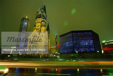 Contrast of the Remembrance Church and the Kaiser Wilhelm Memorial Church, illuminated at night, Kurfurstendam, Berlin, Germany, Europe