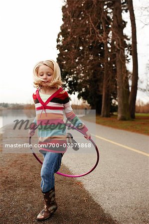 Girl Jumping through Hula-hoop