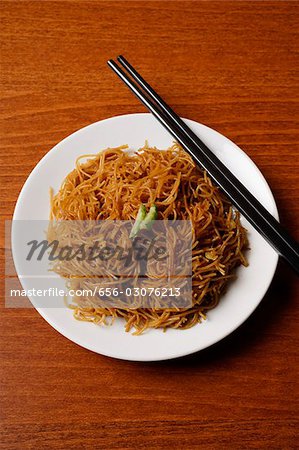 Chinese noodles with chopsticks.