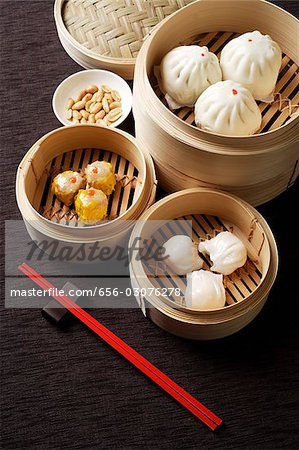 Assortment of dim sum in bamboo steamers.