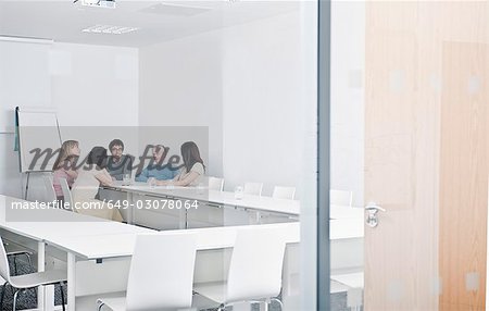 relaxed work group in meeting room