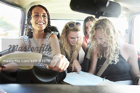 Friends packing a car