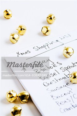 Christmas shopping list and baubles Christmas shopping list and baubles