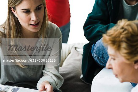 Woman speaking to elderly mother