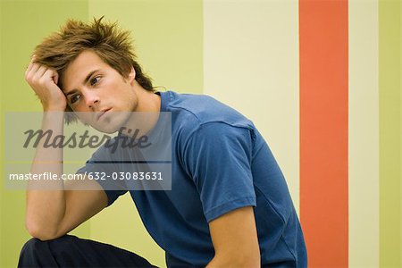 Young man deep in thought